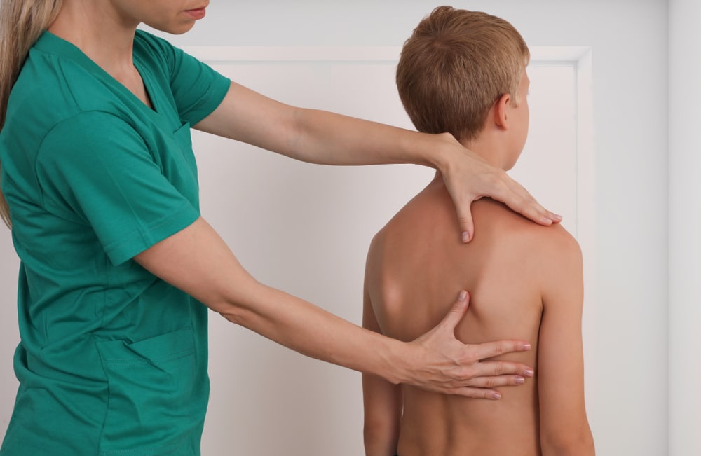 Osteopath treating a child