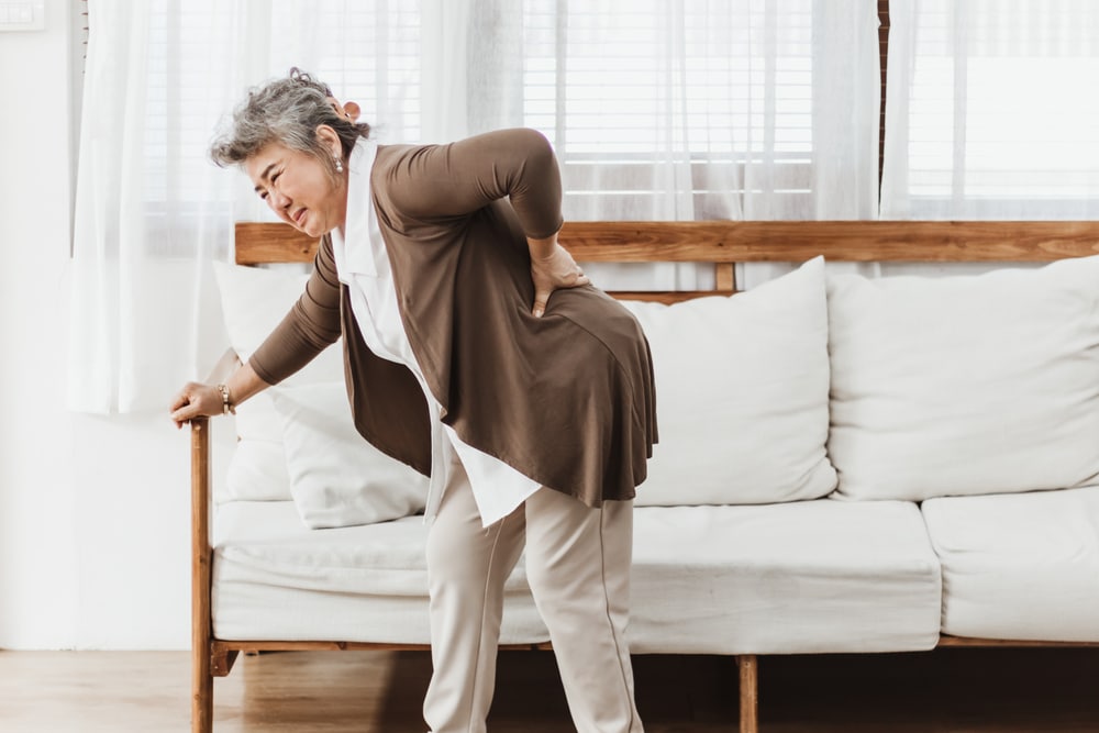 Elderly woman with back pain