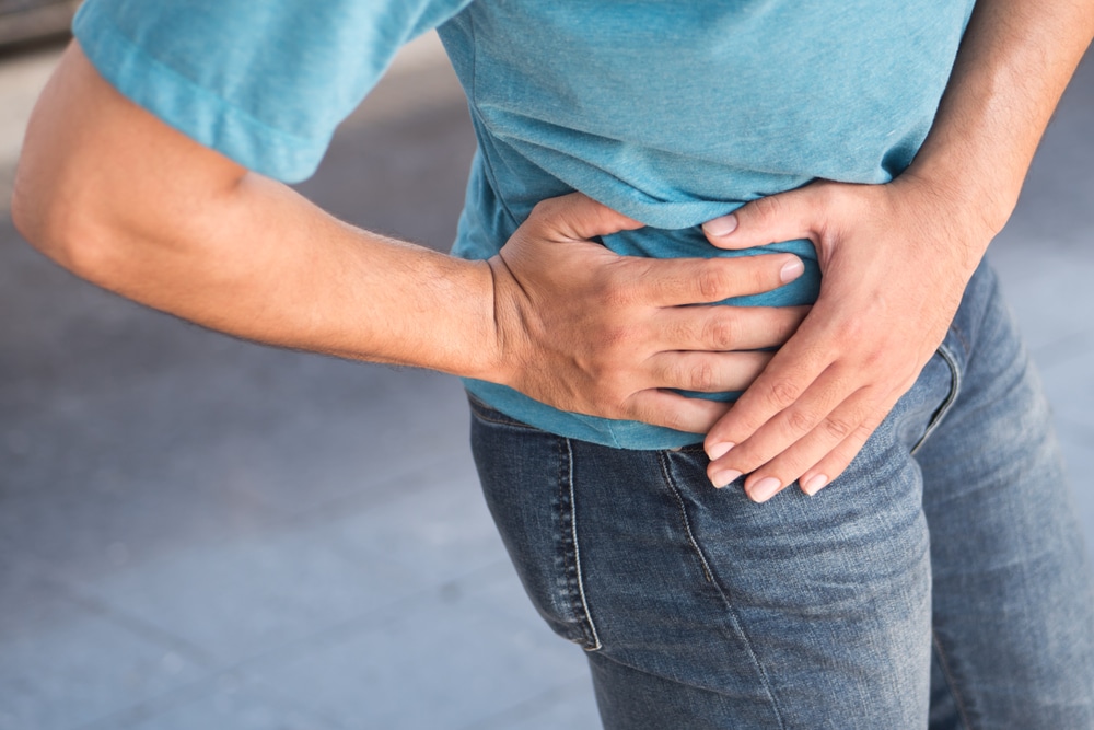 Woman holding hip in pain