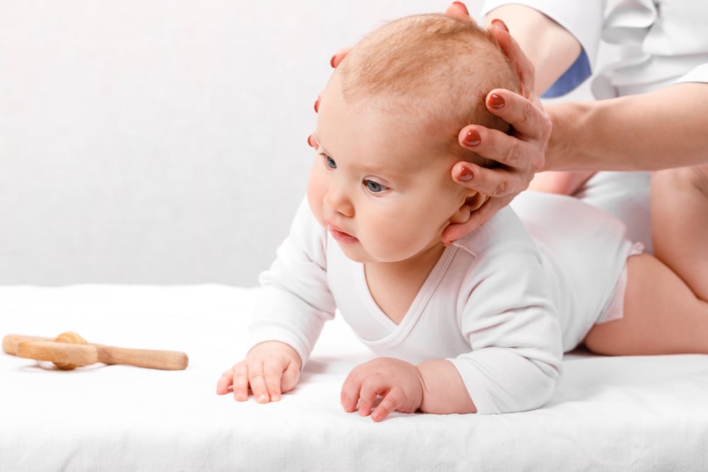 Osteopath treating a baby