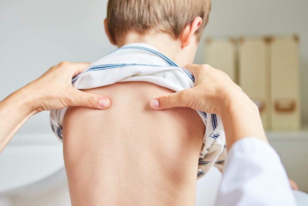 Osteopath treating a child