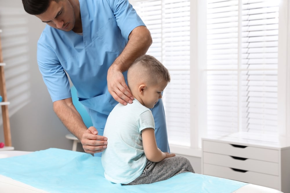 Osteopath treating a child