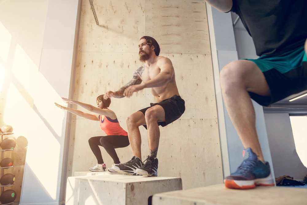 People exercising by jumping