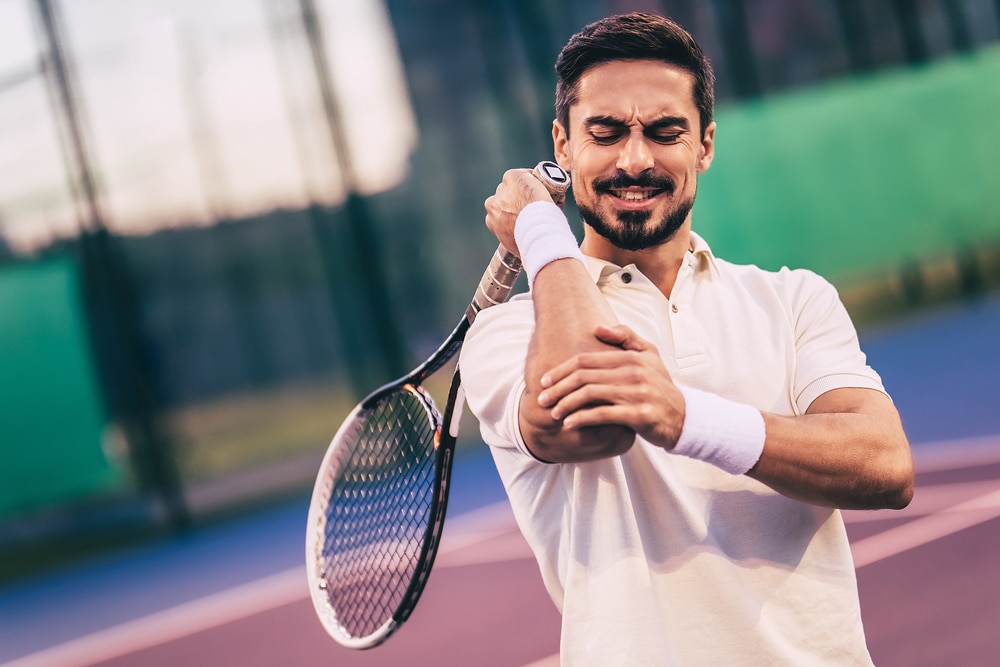 Tennis player with elbow pain