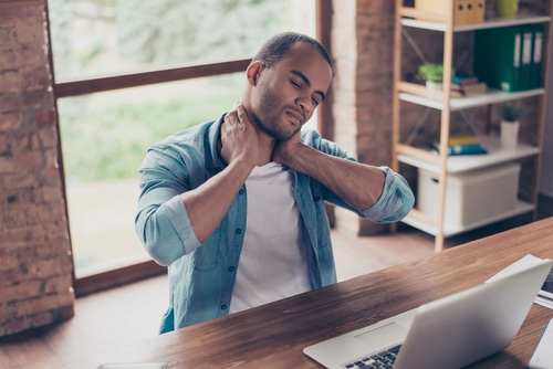 Man holding his neck in pain